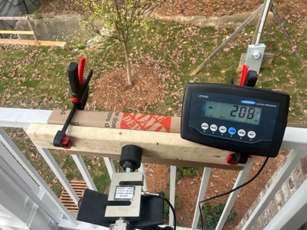 Railing load test using chain hoist and load cell setup